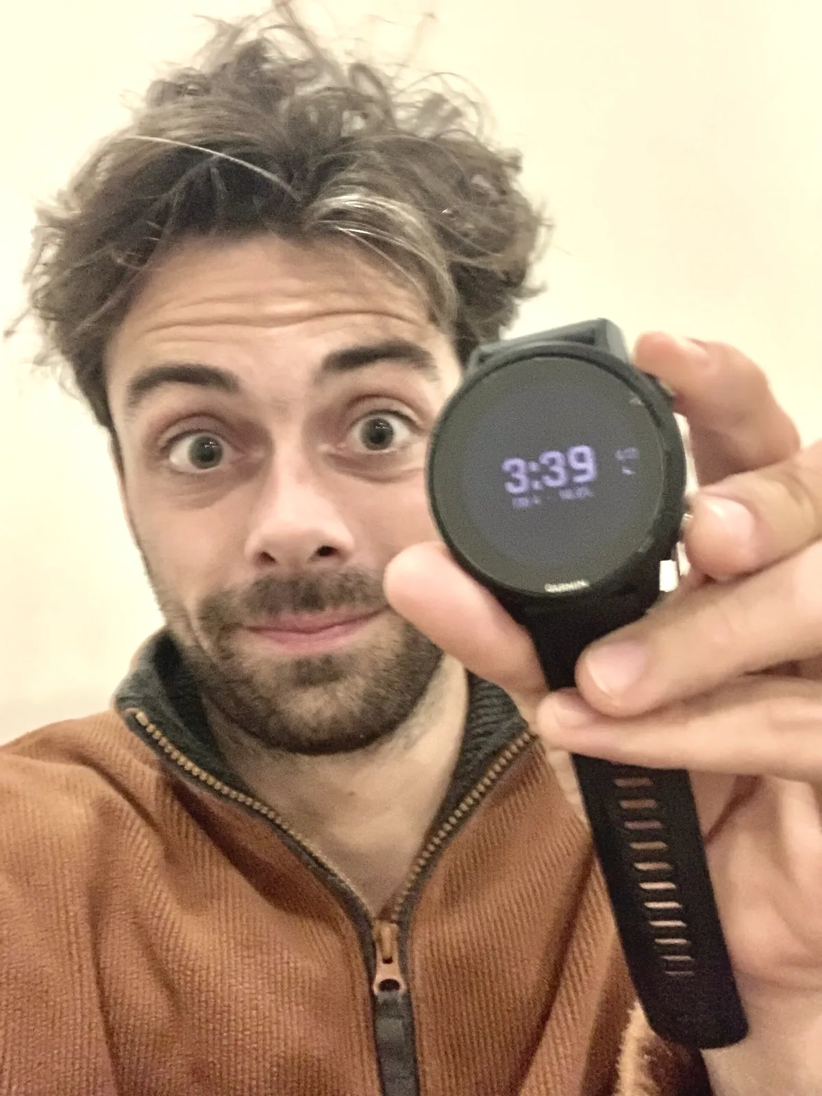 Jacob holding up his watch, showing 3:39am